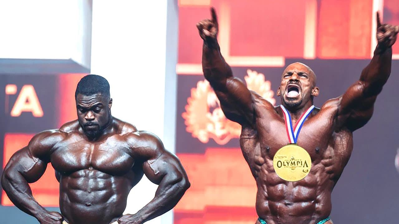 Big Ramy as he wins the 2021 Mr. Olympia next to Brandon Curry who came in second.